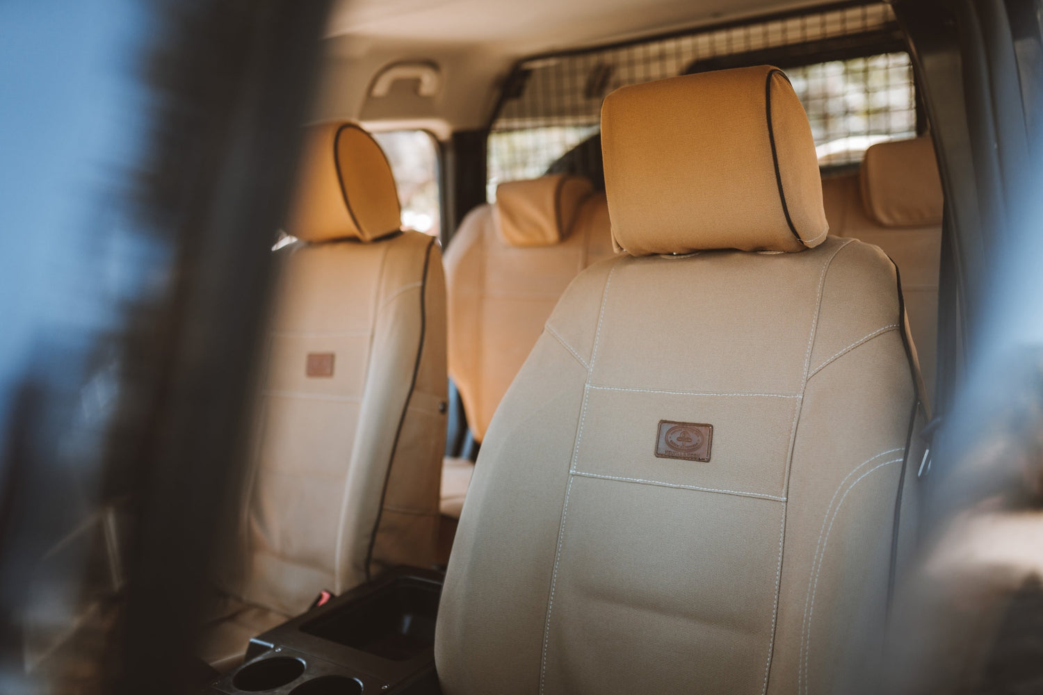 Melvill & Moon seat covers for Ineos Grenadier in Sand colorway.