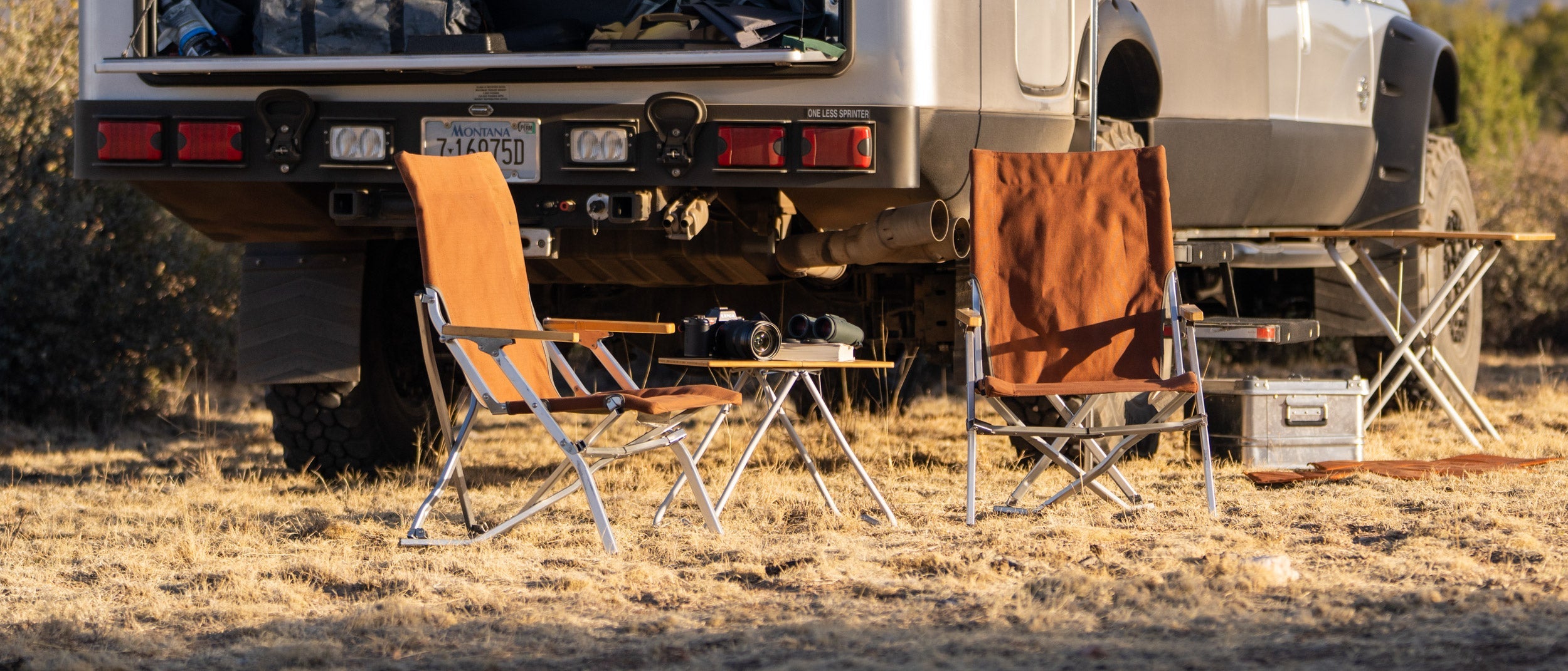 Snow Peak Low Beach Chairs in camp scene with earthroamer