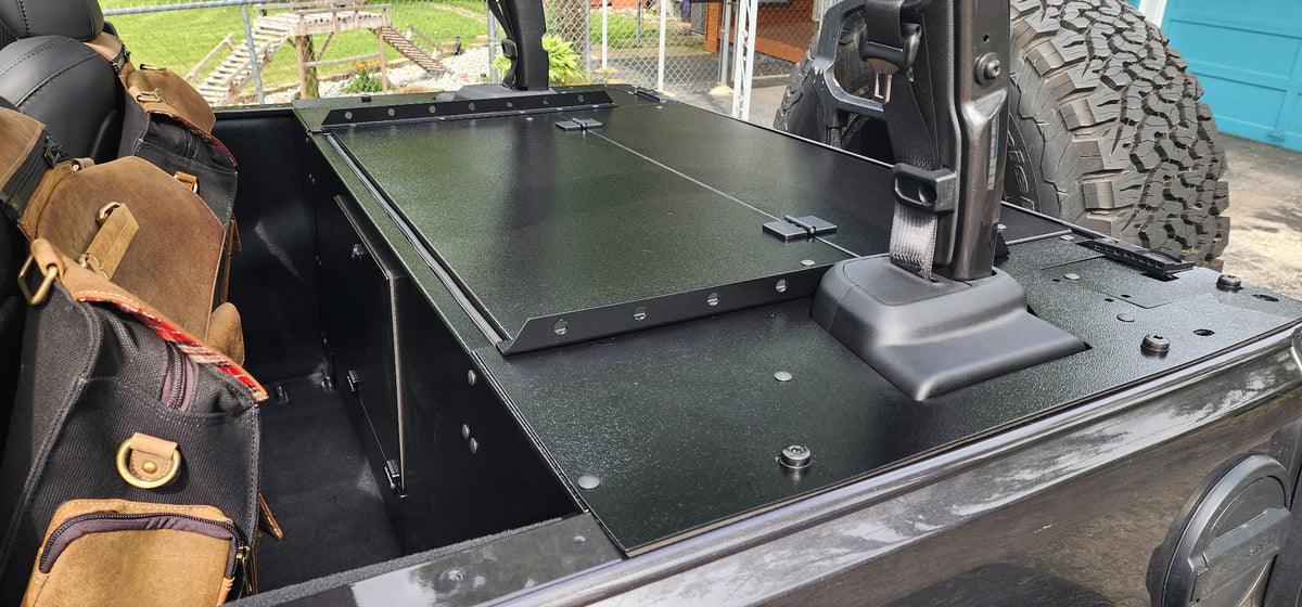 Slipstream folding top closed in a gray 2024 JL 2-door, bags on the seat beside it