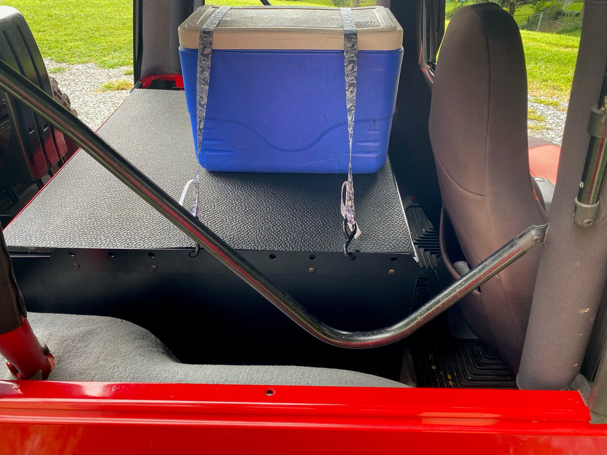 Side view of the Ridgeback in a red TJ with a cooler on top
