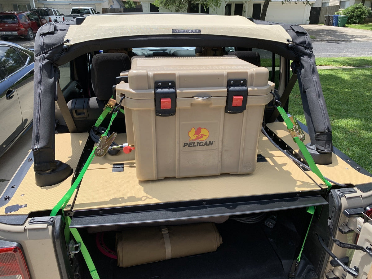 Pelican cooler ratchet-strapped onto the Slipstream top in a tan Jeep