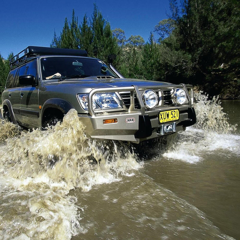ARB Deluxe Winch Bull Bar for Nissan Patrol GU — front three-quarter studio view