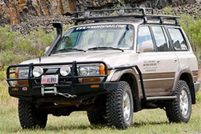 ARB Deluxe winch bumper on a Toyota Land Cruiser 80 Series — front three-quarter view