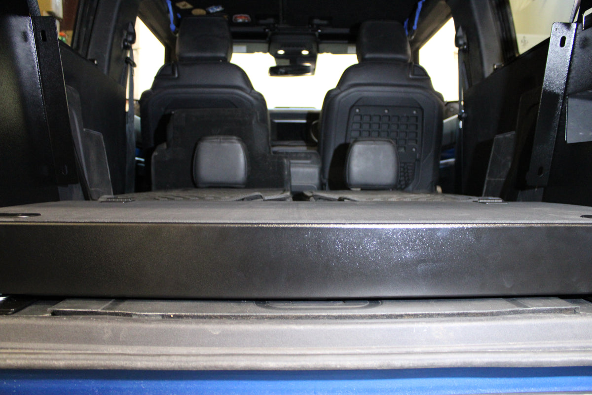 Close view of the Stage front edge behind the Bronco rear seats