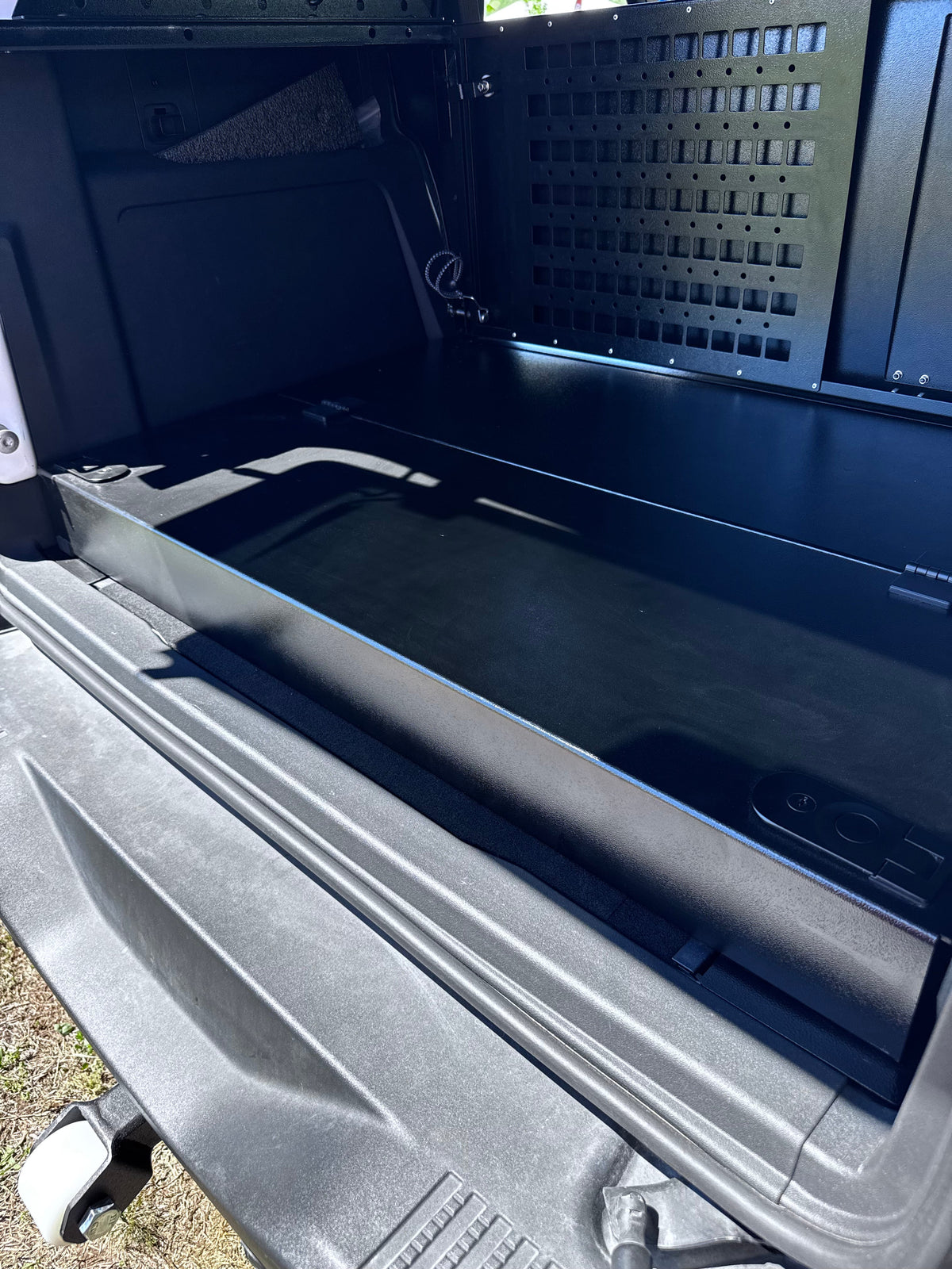 Stage platform in a Bronco 4-door, second angle with the MOLLE wall