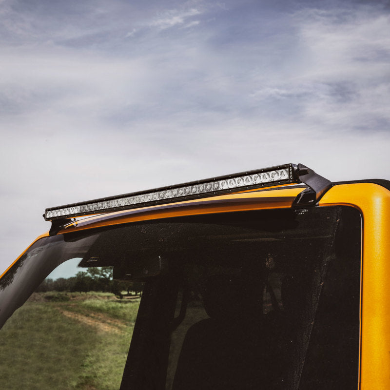 Rigid roof line bar brackets mounted at the A-pillars of a Ford Bronco