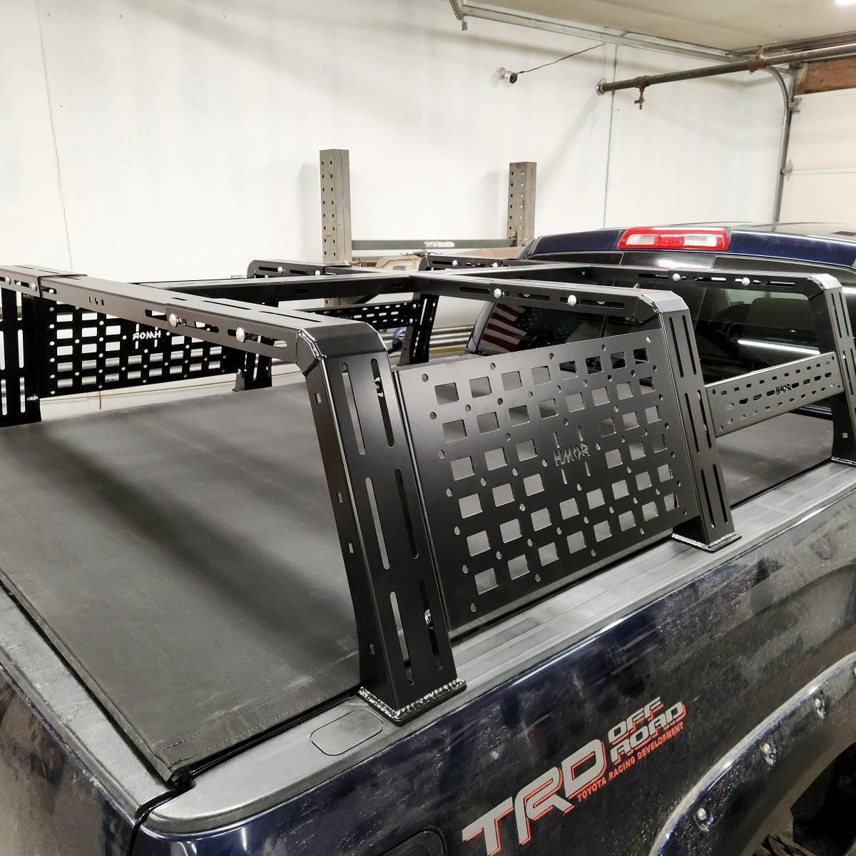 ROCK-IT rack MOLLE panel and crossbar over a Tundra TRD bed cover