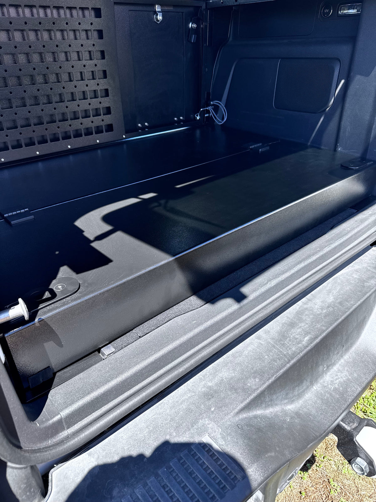 Bronco 4-door Stage installed in the cargo area below a MOLLE wall
