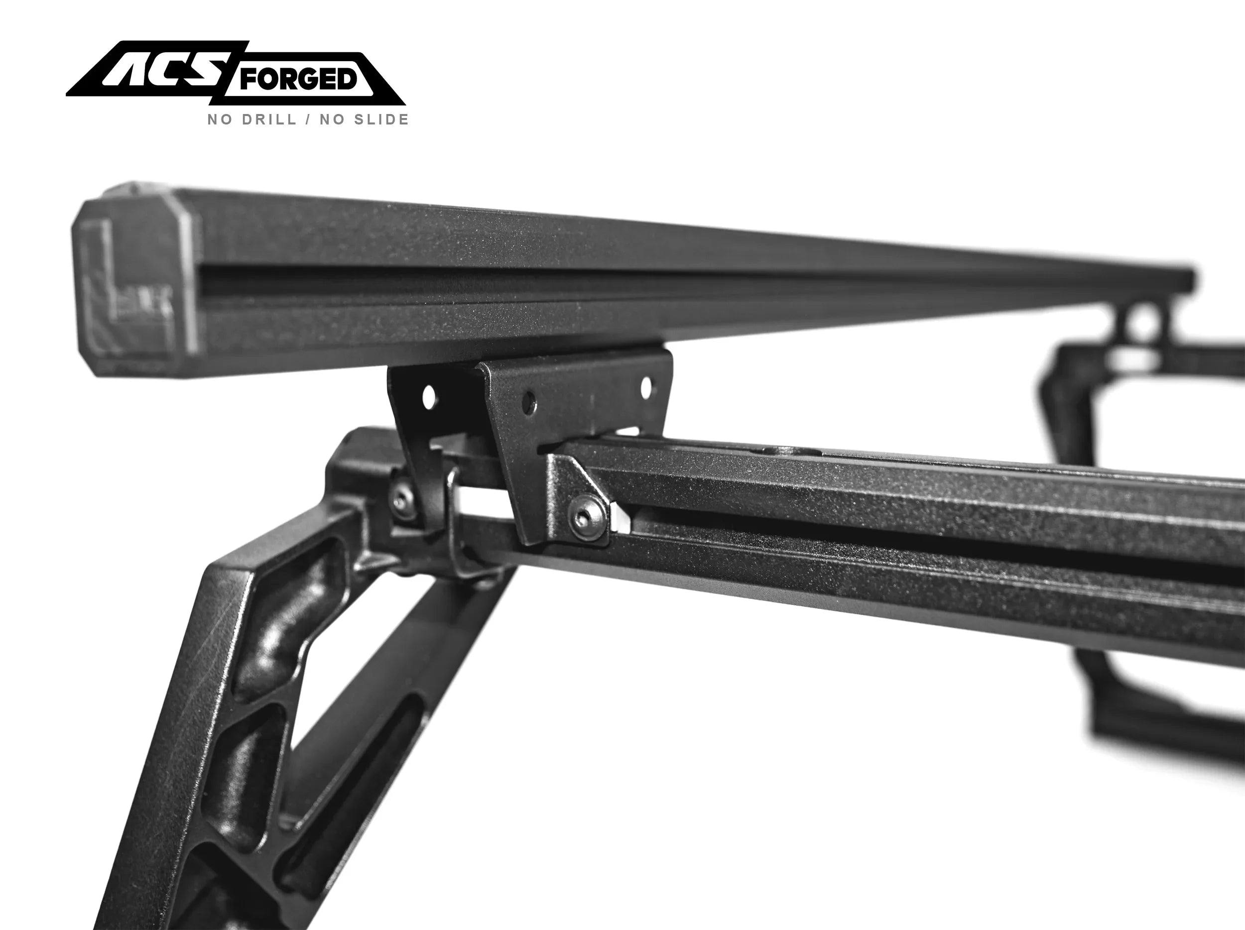 CLOSE UP OF STATIONARY LOAD BAR AND BRACKET ON ACS FORGED BED RACK