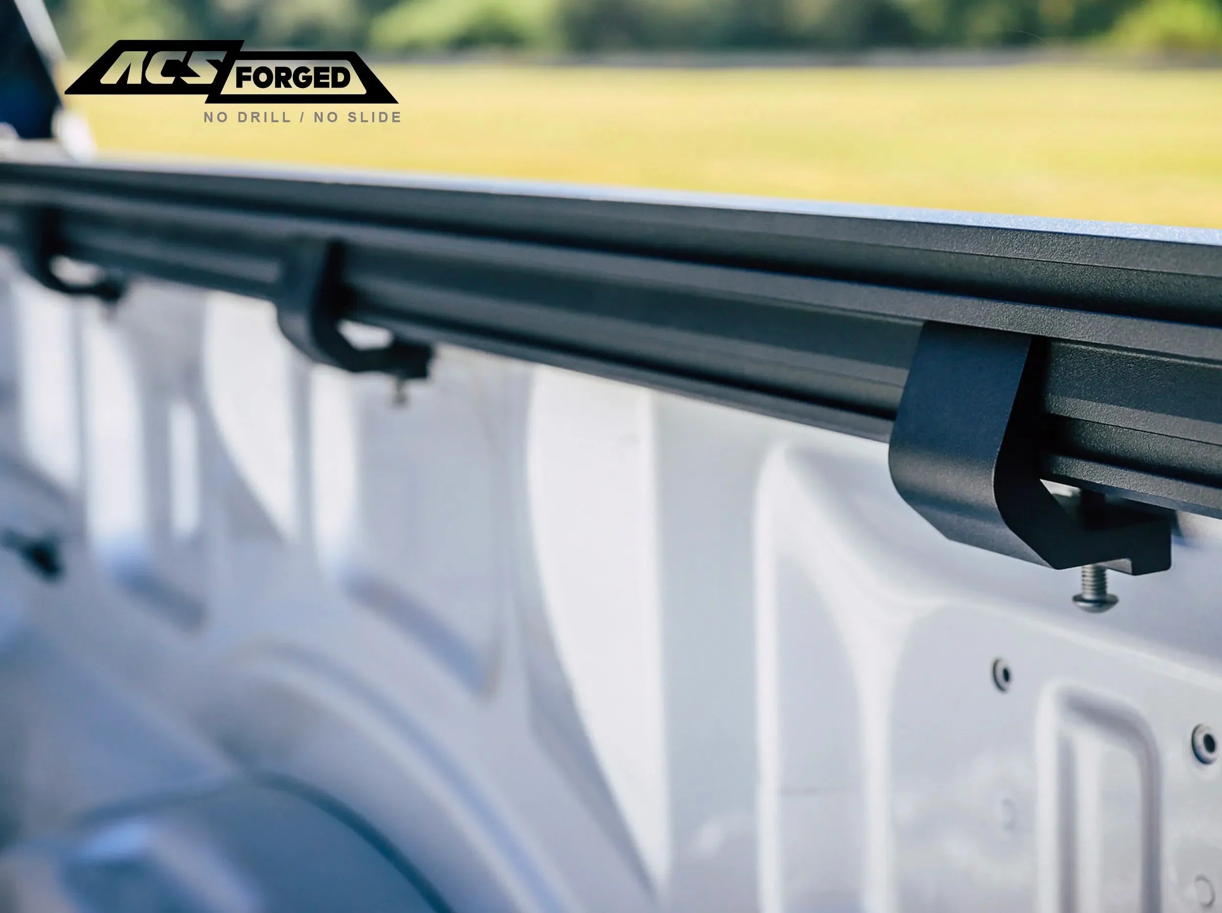 CLOSE UP VIEW OF CLAMPS ATTACHED TO SIDE RAIL ON ACS FORGED BED RACK