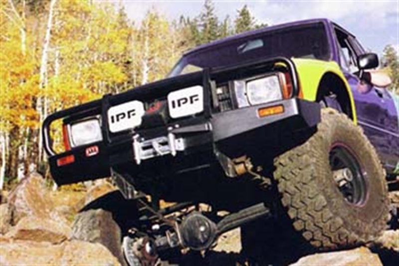 ARB Deluxe winch bumper on a 1986-95 IFS Toyota Pickup — front three-quarter view