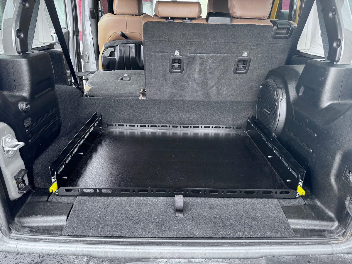 Slide Floor 2.0 retracted in a JLU cargo area behind the folded rear seat