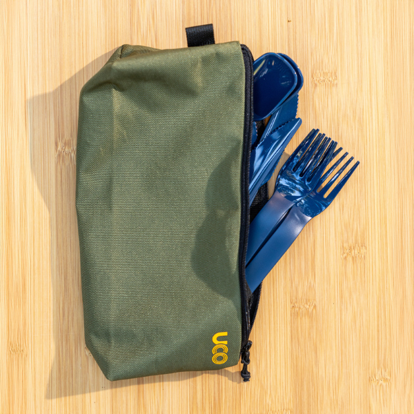 Olive green utensil case standing upright with utensils tucked partially inside
