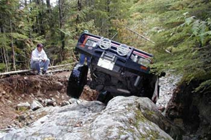 ARB Deluxe winch bumper on a 1984-85 live-axle Toyota Pickup — front three-quarter view
