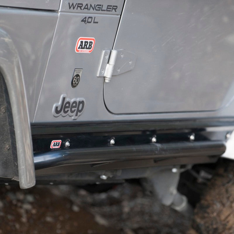 ARB rock slider underside showing frame mounting points on Wrangler TJ