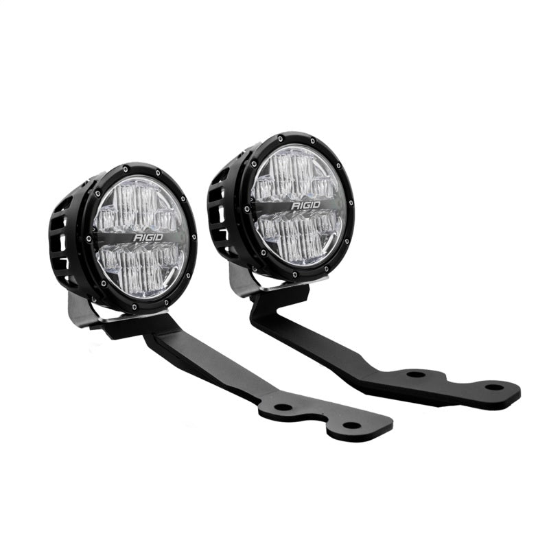 Rigid 360-Series lights with amber backlighting illuminated at night on a Tundra