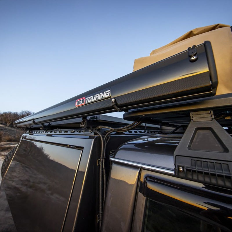 ARB awning mounted to a vehicle roof platform, side view