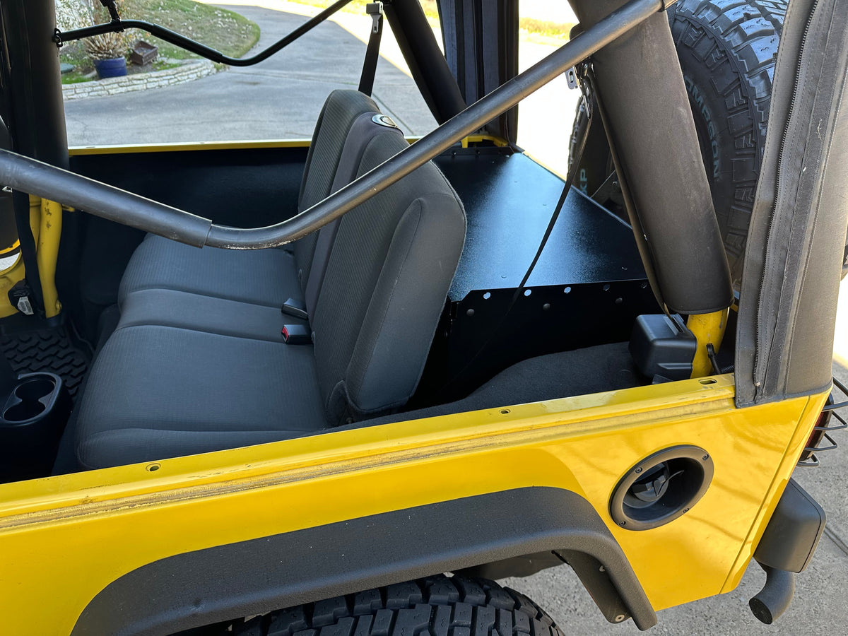 Side view of the Ridgeback Basic in a yellow LJ beside the roll bar