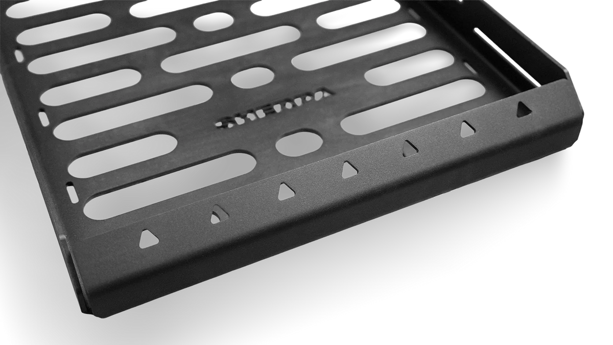 Overhead studio shot of the Roof Rack Storage Basket showing the stamped Sherpa logo, reversed angle