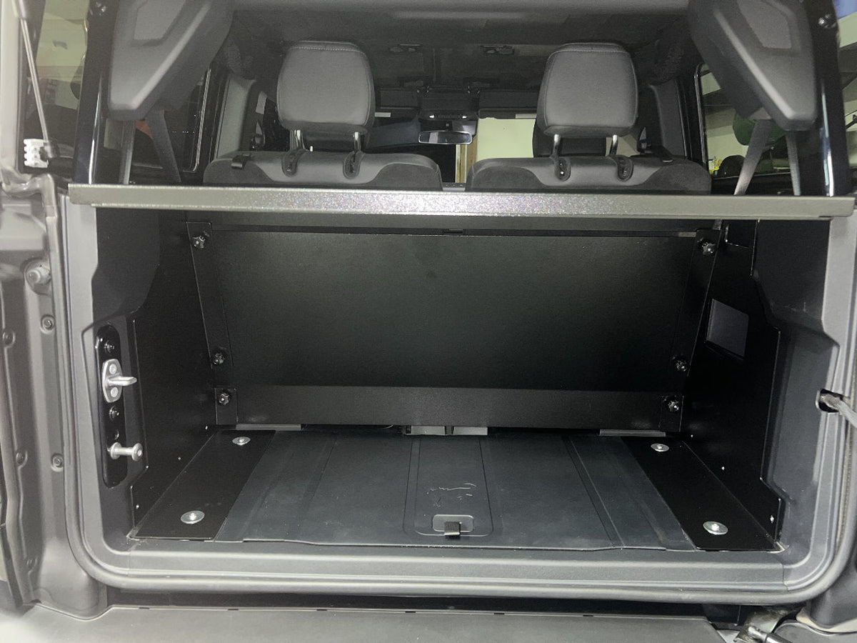 Rear view of a Bronco 2-door with the tailgate open and the Locker installed