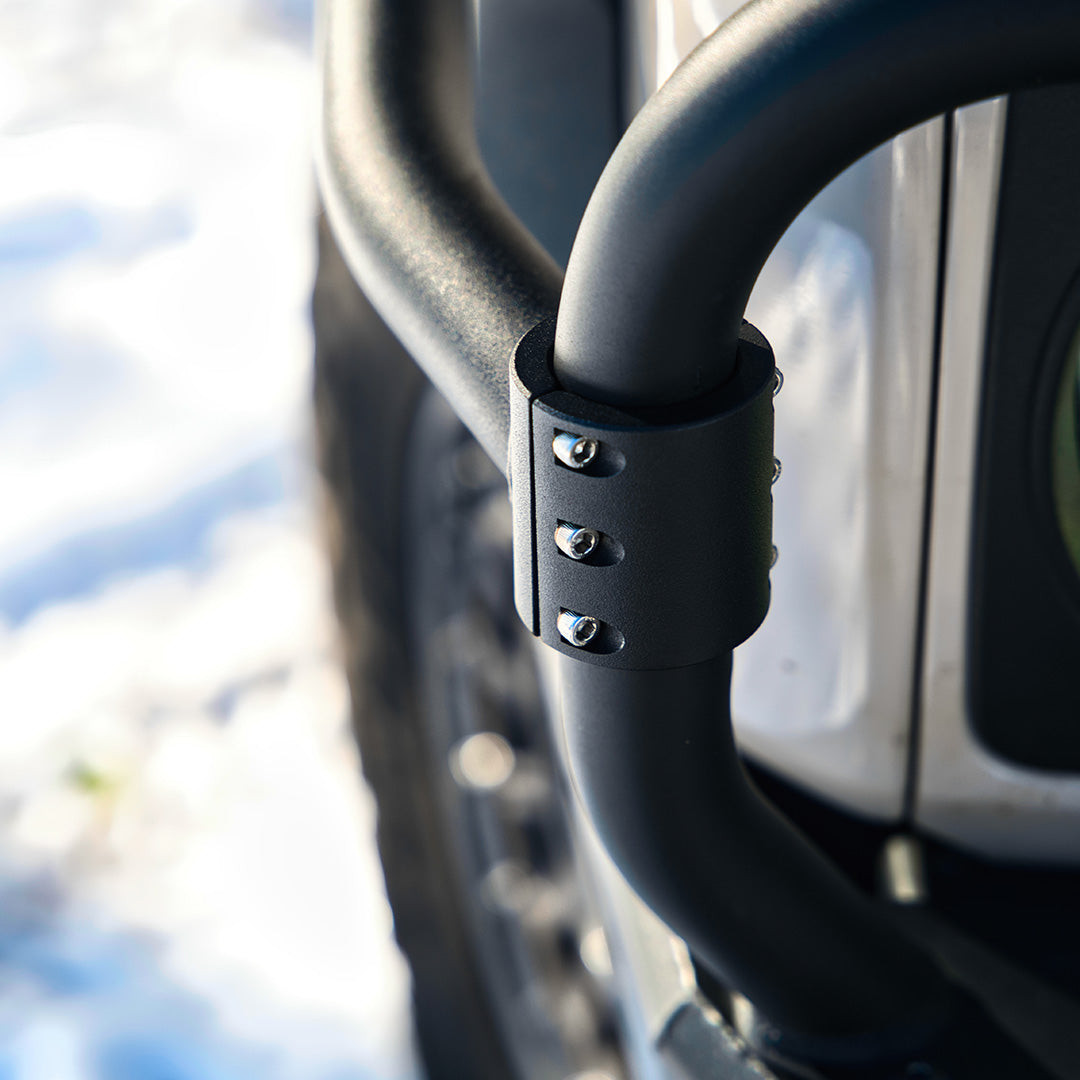 Close view of a black bull bar tube with a clamp bracket