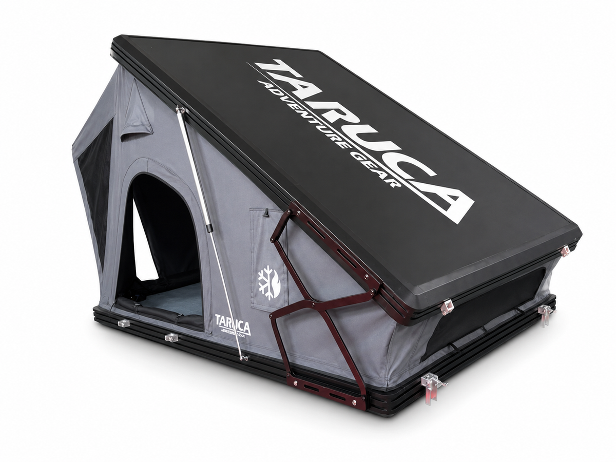 Taruca Dark Rogue rooftop tent partly open showing the black hard-shell lid with Taruca Adventure Gear logo