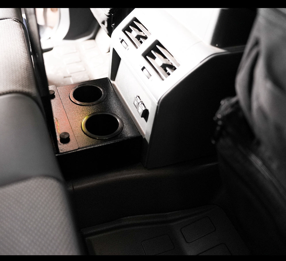 Diabolical rear seat cupholder mounted at the Grenadier rear seat beside the console vents