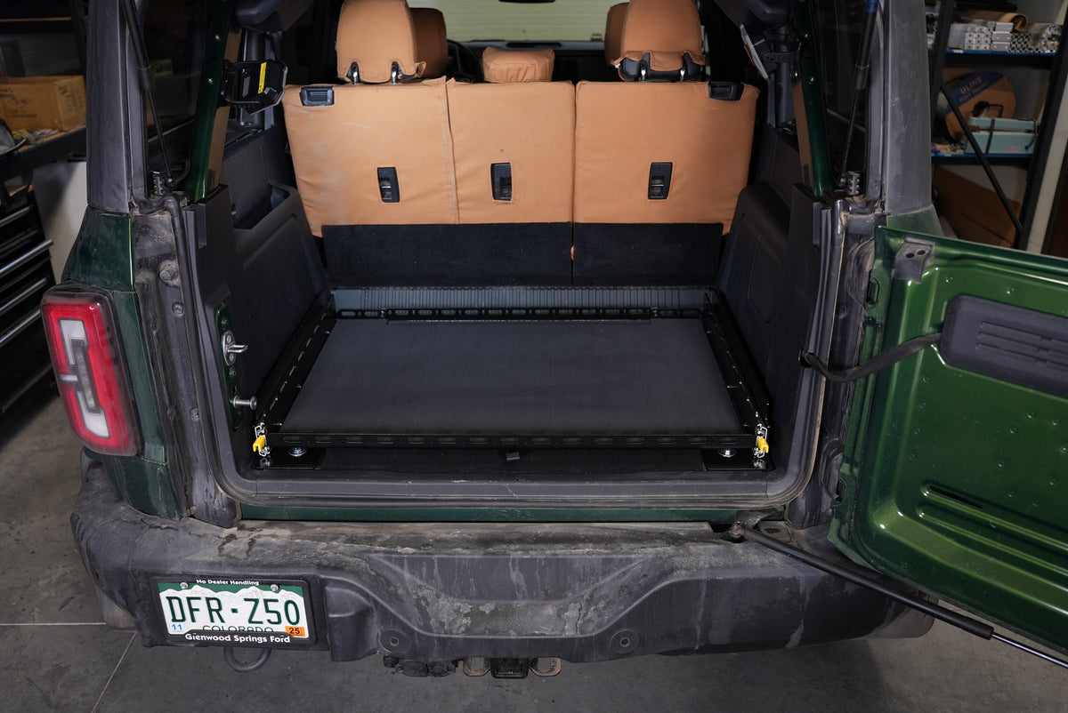 Bronco Slide Floor 2.0 retracted in the cargo area, tailgate open