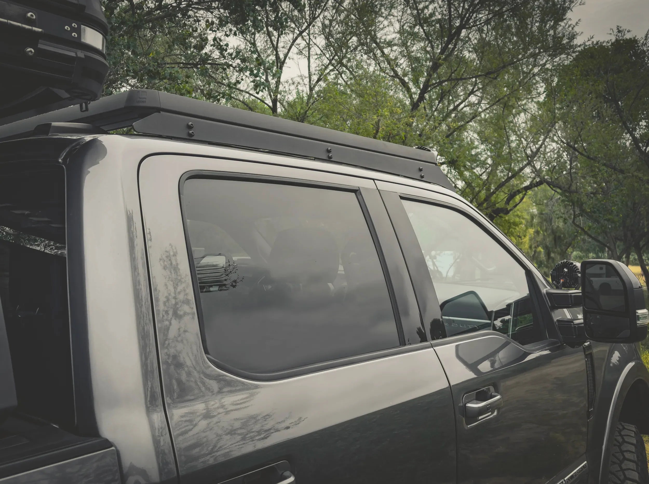 SIDE VIEW OF ACS ROOF RACK INSTALLED ON SUPERDUTY
