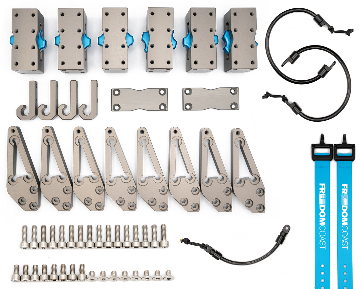 MODmount PROpack contents laid out: bases, hooks, arms, strap caps, cords, straps and bolts