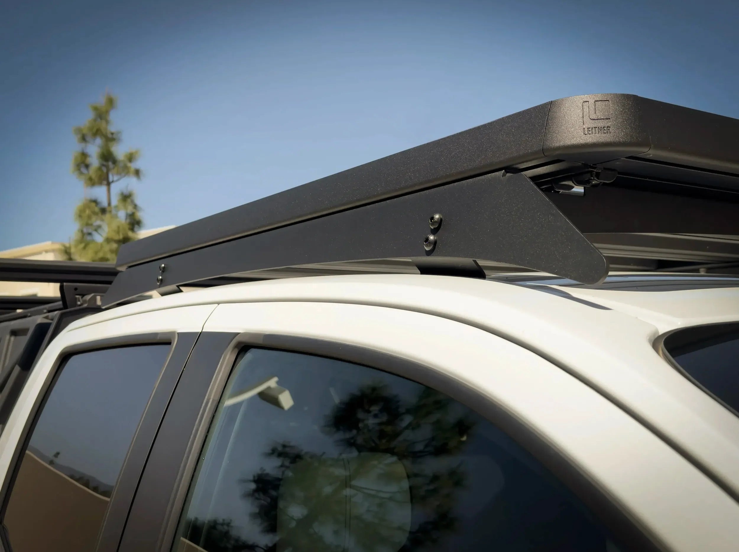 CLOSE UP OF ACS ROOF RACK ON WHITE GMC CANYON