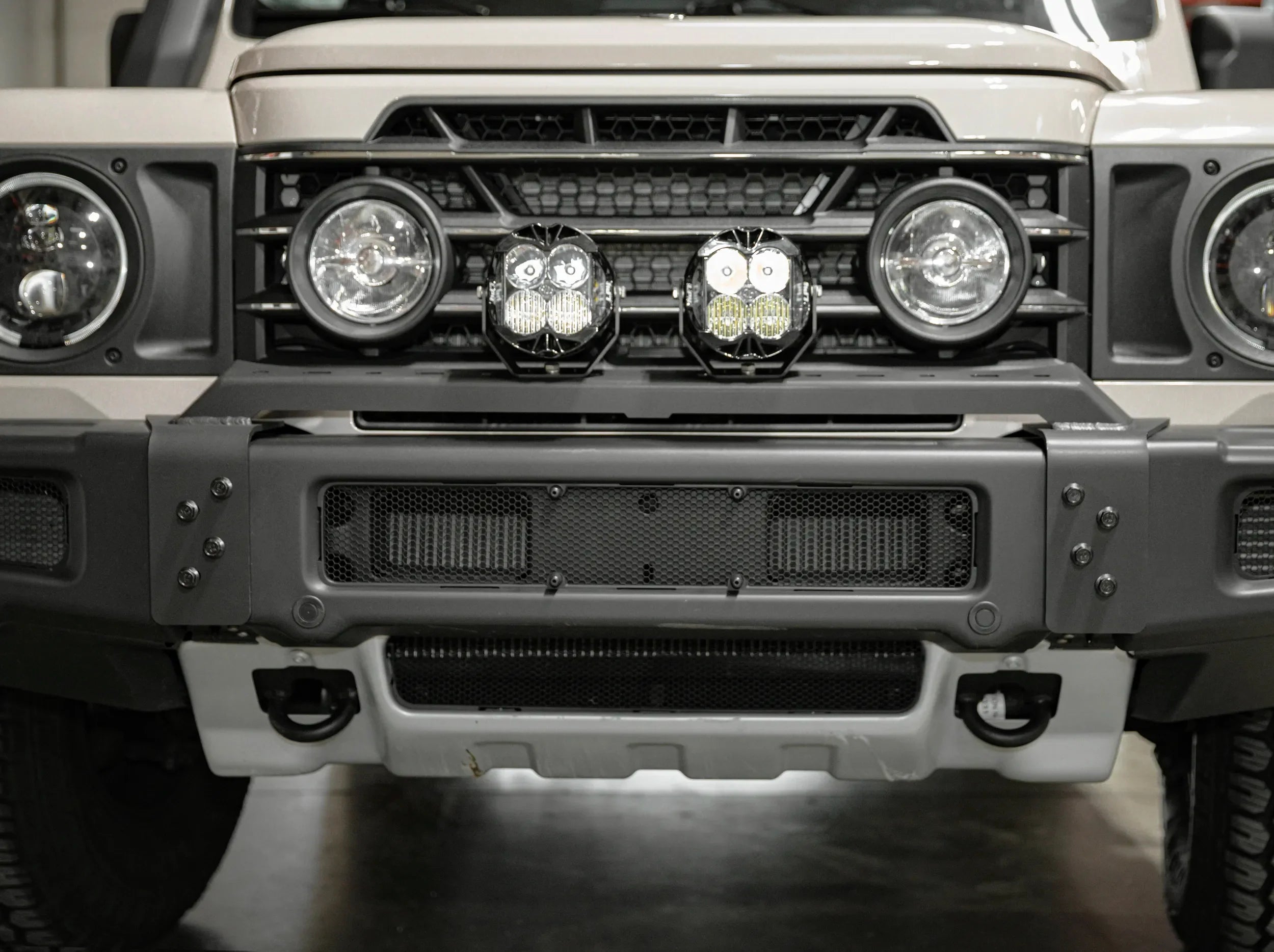 METAL FRONT BUMPER MOUNTED ON GRENADIER WITH LIGHTS
