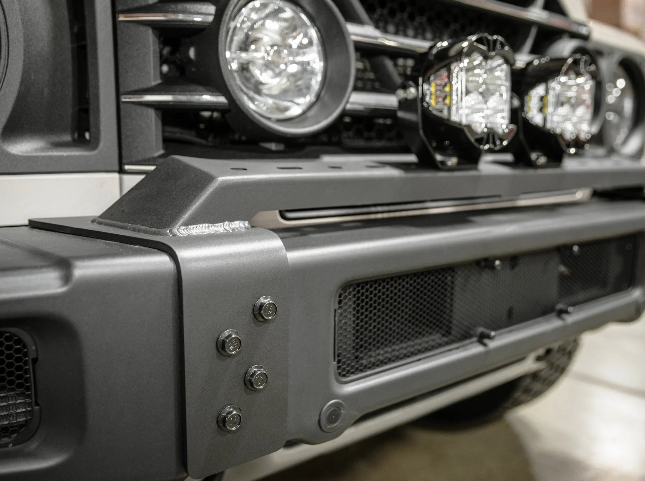 SIDE VIEW OF METAL FRONT BUMPER FOR GRENADIER TO MOUNT LIGHTS