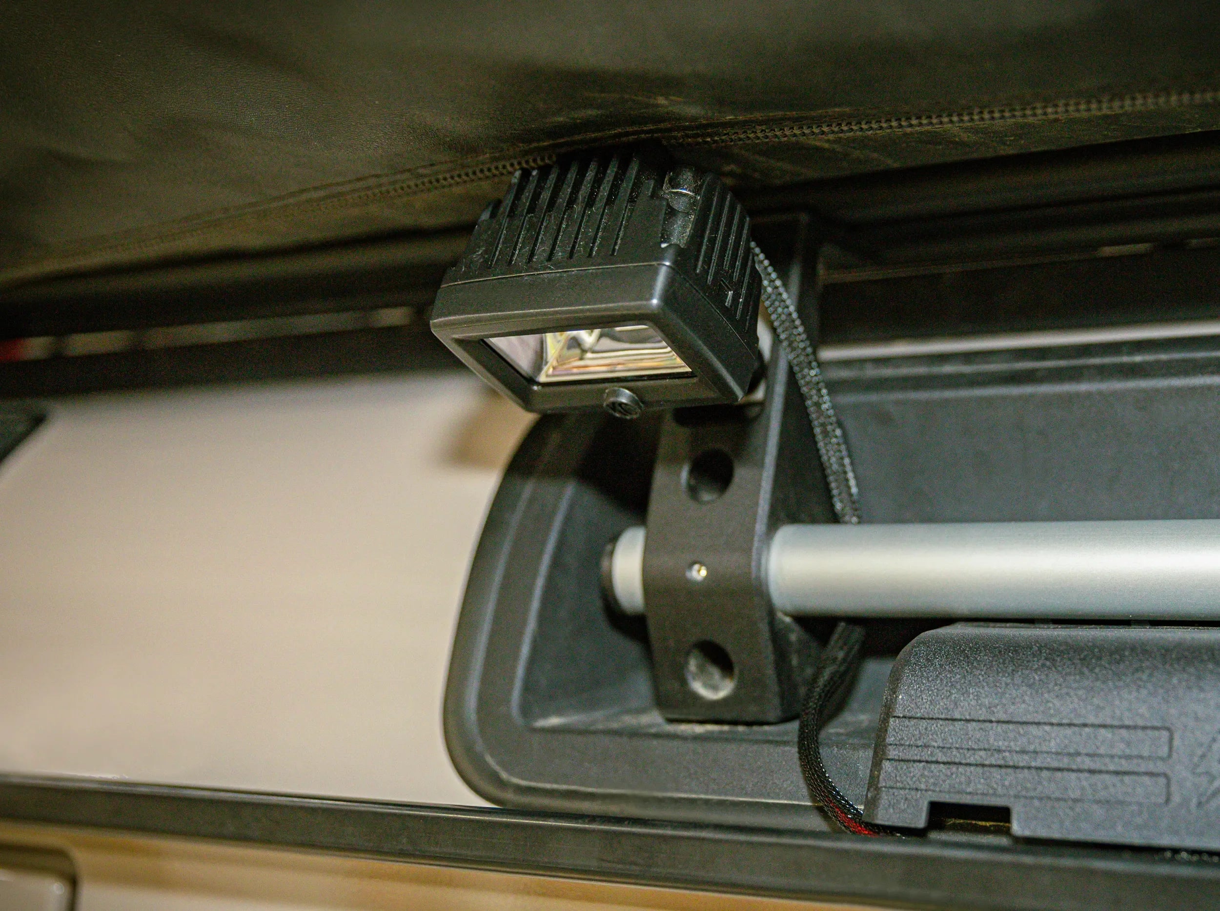 LED SCENE LIGHT MOUNTED TO GRENADIER ROOF RACK USING BRACKET