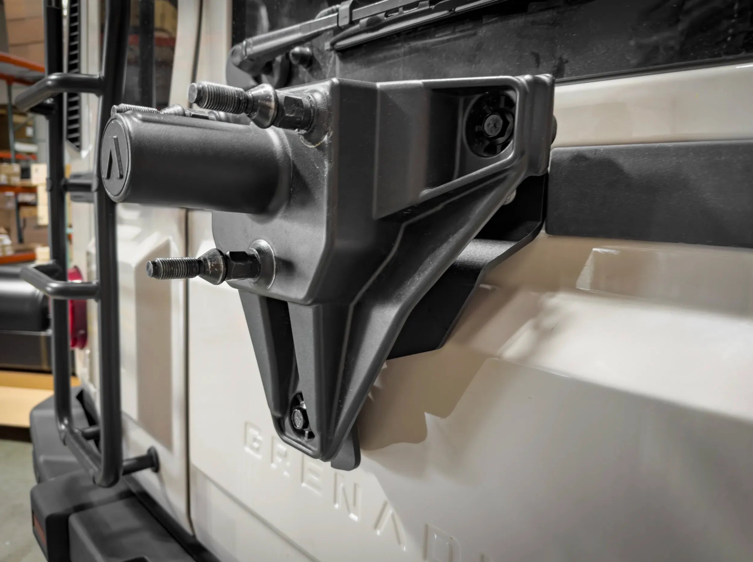 TIRE RELOCATIN BRACKET MOUNTED ON REAR OF GRENADIER