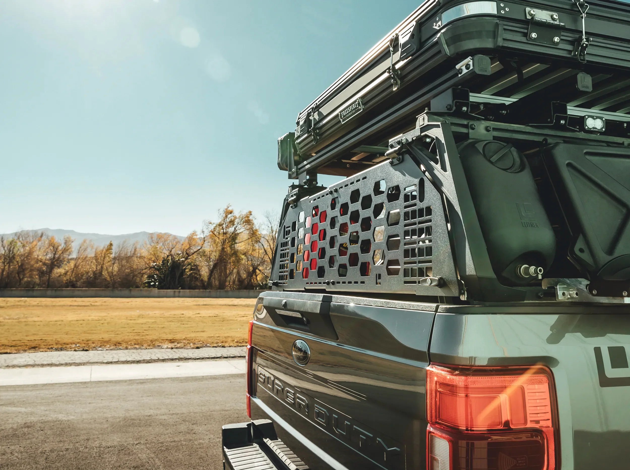 SIDE VIEW OF BLACK MOUNTED GATE ON REAR OF ACS FORGED BED RACK