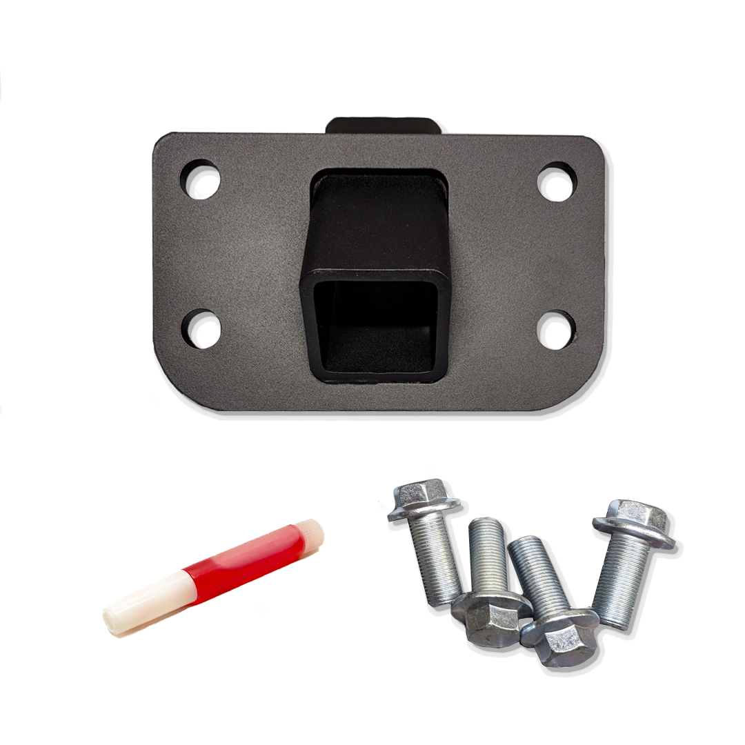 Black hitch receiver plate with four bolts and a red and white item beside it