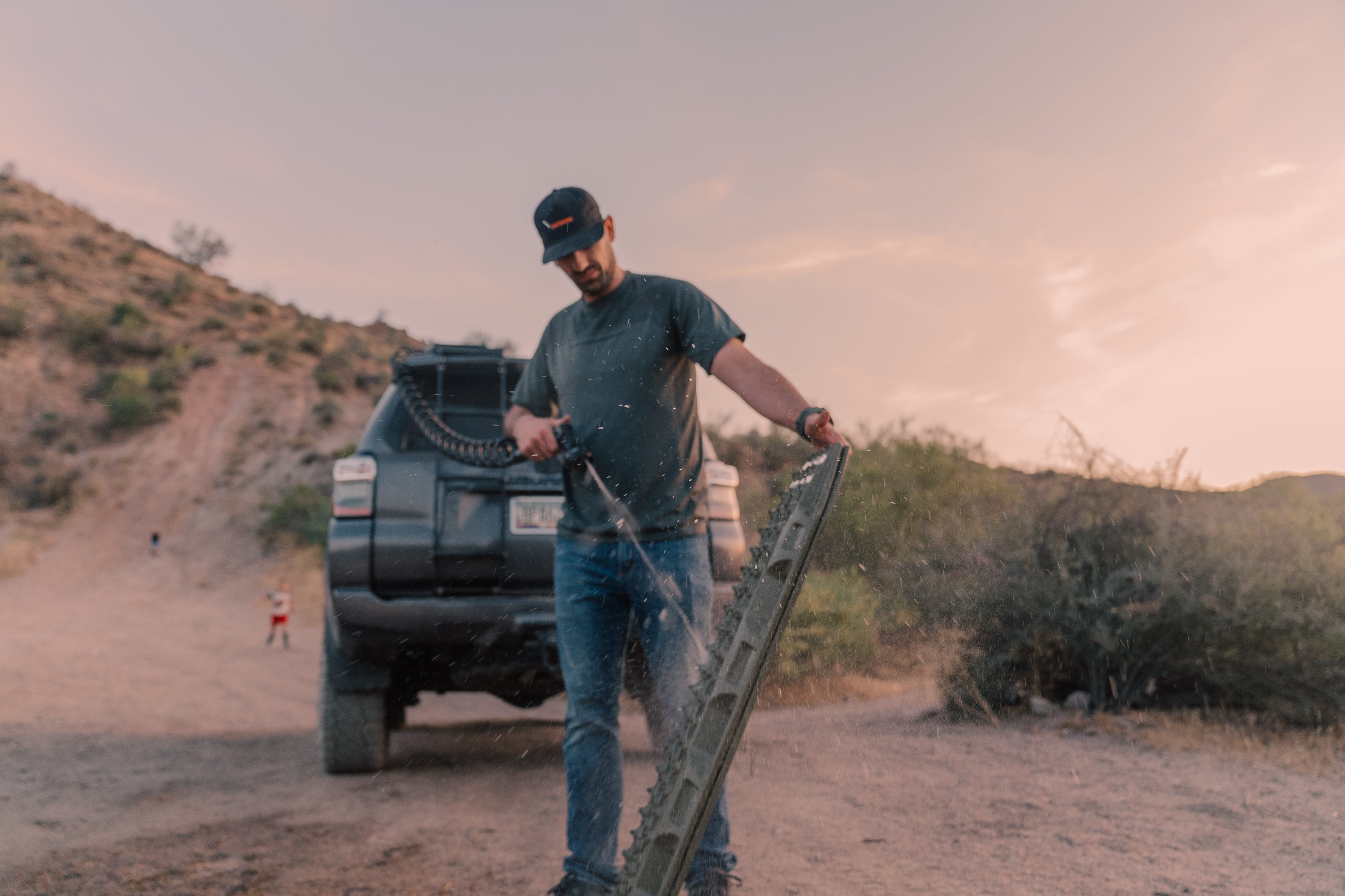 ROAM 8.5-gallon pump tank with traction boards on rack