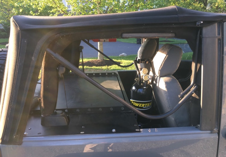 Slipstream behind the front seats, seen through a JK soft top