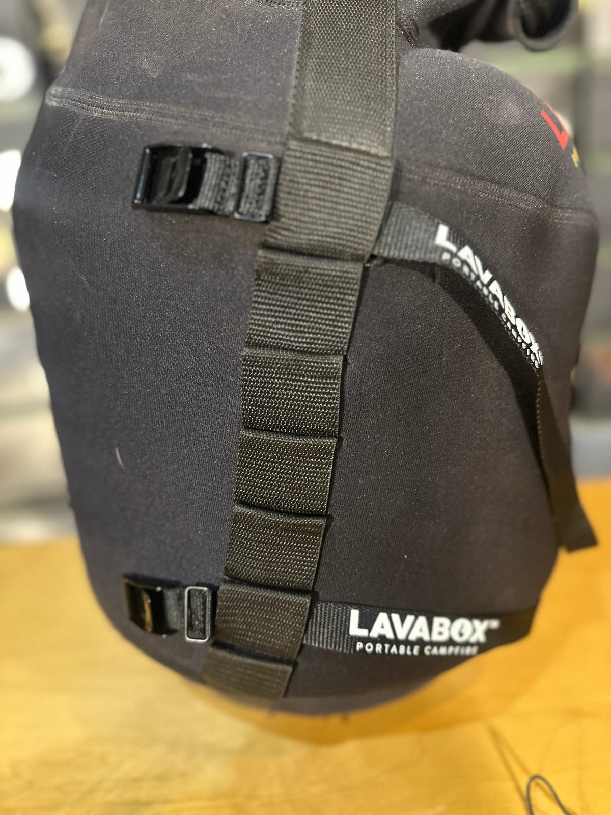 Close-up of the black neoprene Tank Top's padded carry handle