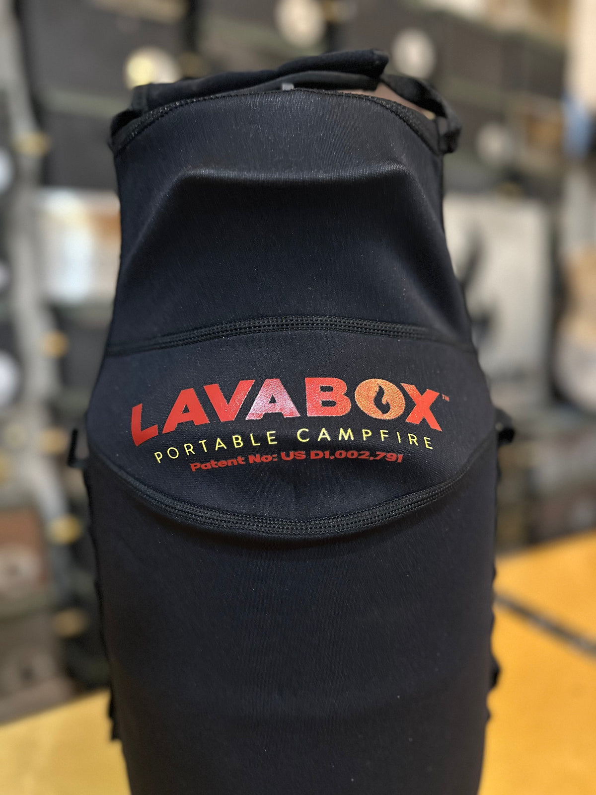 Close-up of the back of a black LAVABOX carry bag showing its embroidered logo and patent number label