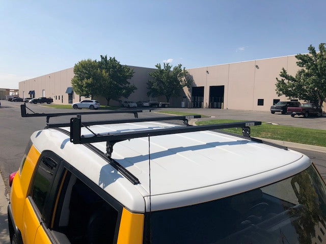Eezi-Awn K9 load bars on a Toyota FJ Cruiser roof