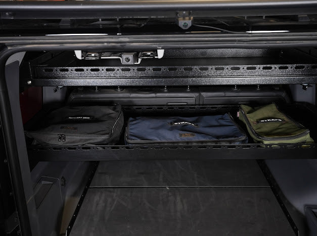 Mid Deck loaded with soft bags behind the Grenadier rear seats