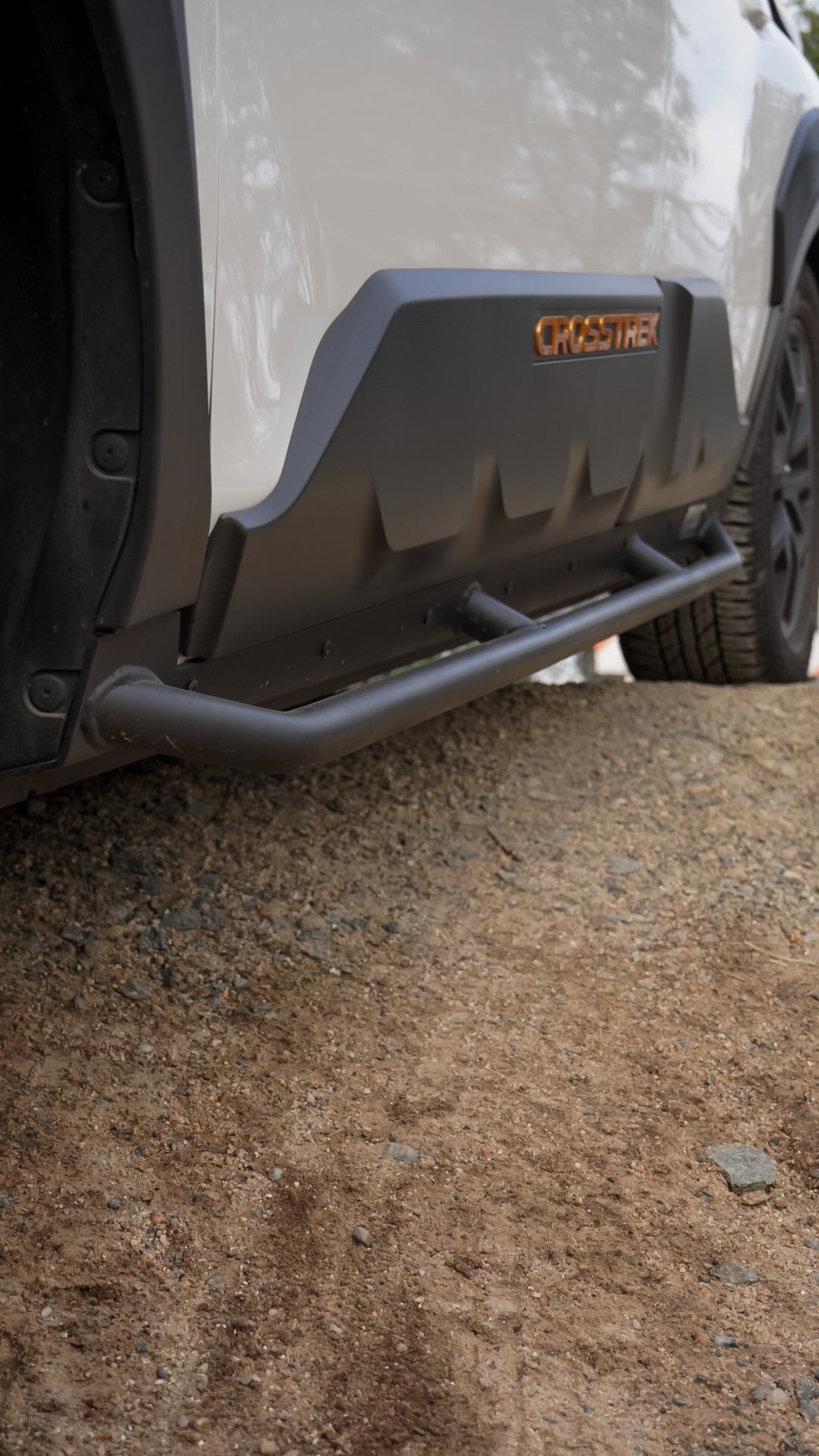 Close view of the front end of the rock slider under the door