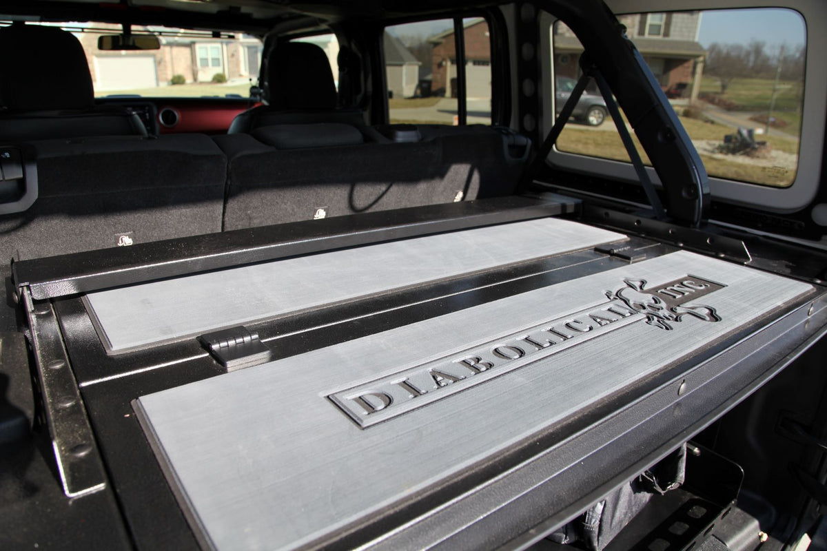Gray engraved logo pads on a Slipstream in a Jeep JL