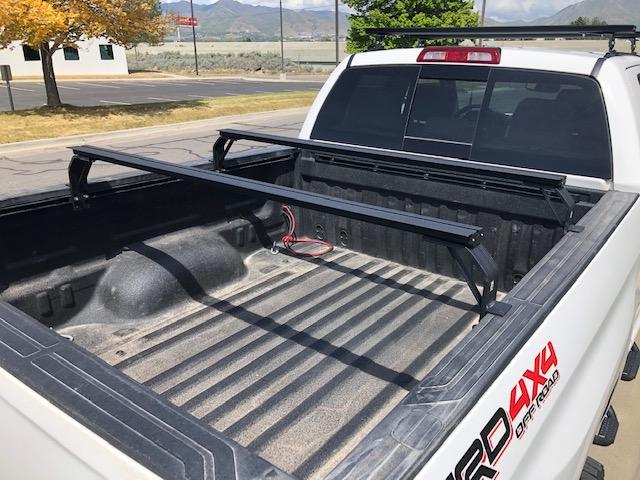 K9 bed rail load bars installed in a truck bed