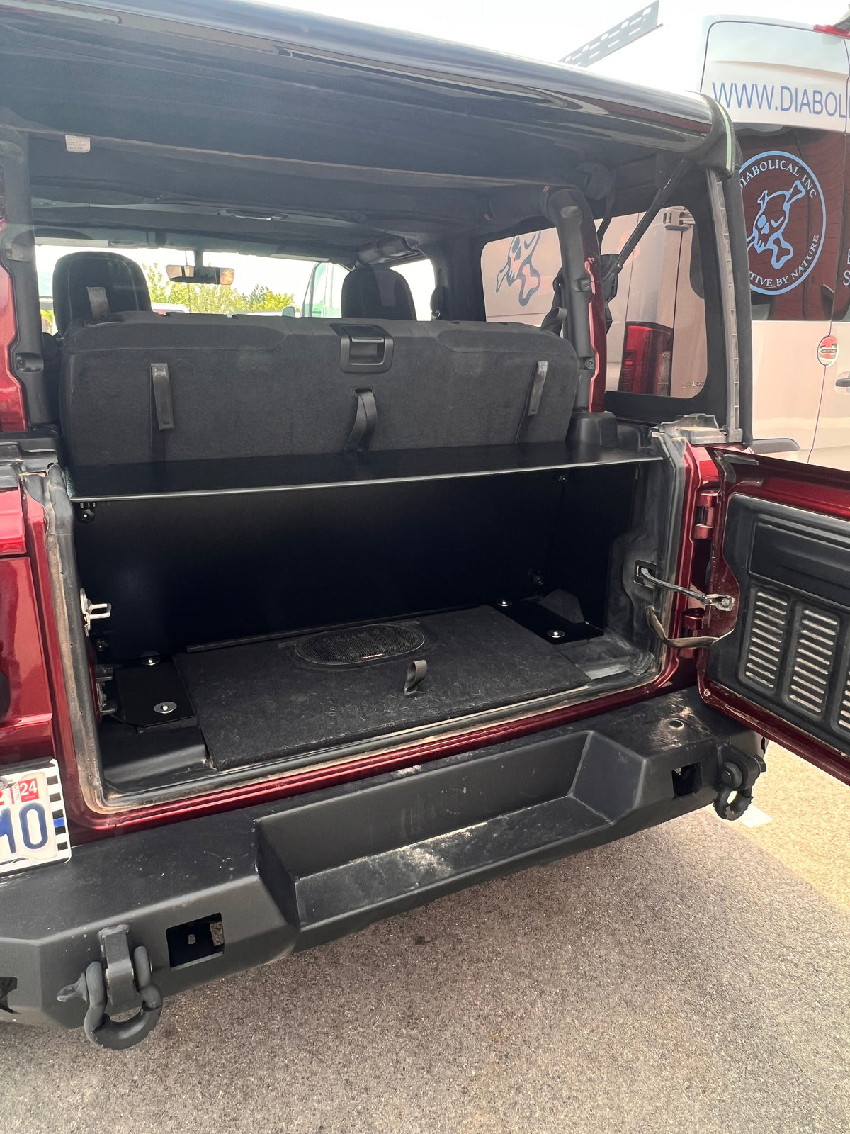 JL Locker across the cargo area with the rear seat in front of it