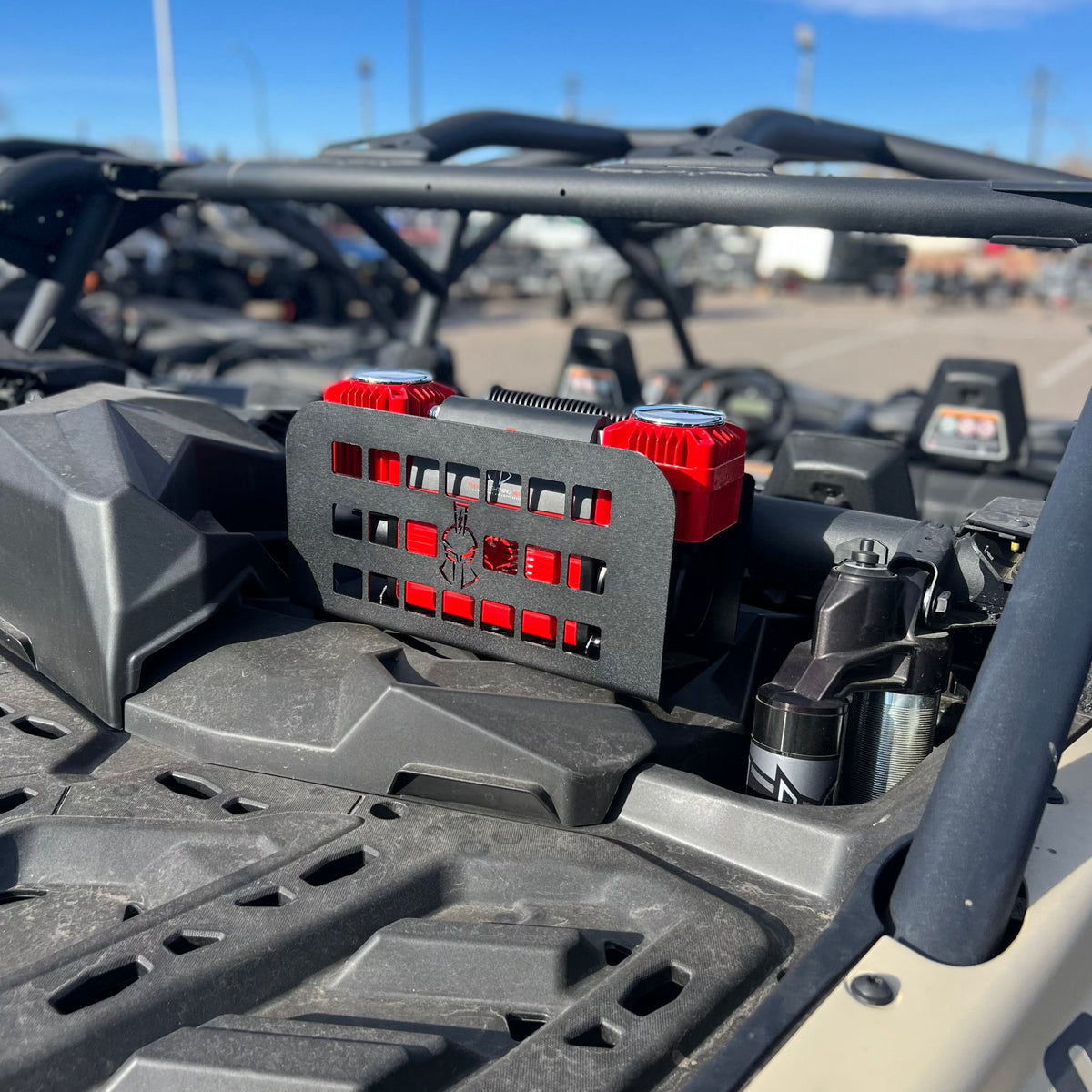 Refuge MOLLE mount installed on a side-by-side's rear cage, wide shot showing surrounding vehicle bed