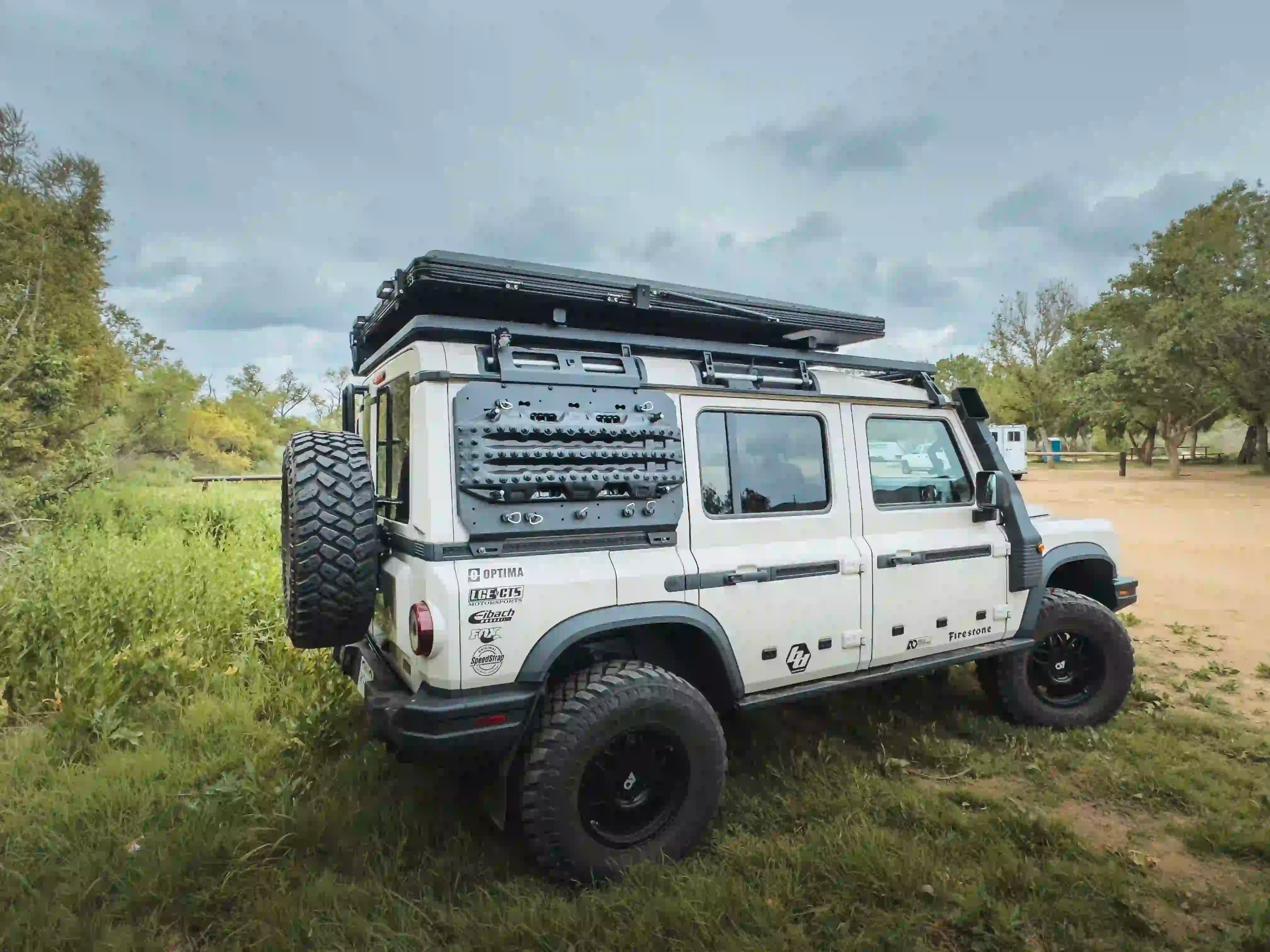 INEOS GRENADIER OUTSIDEWITH ROOFTOP TENT INSTALLED ON LOAD BAR ADAPTERS ON ACS PLATFORM ROOF