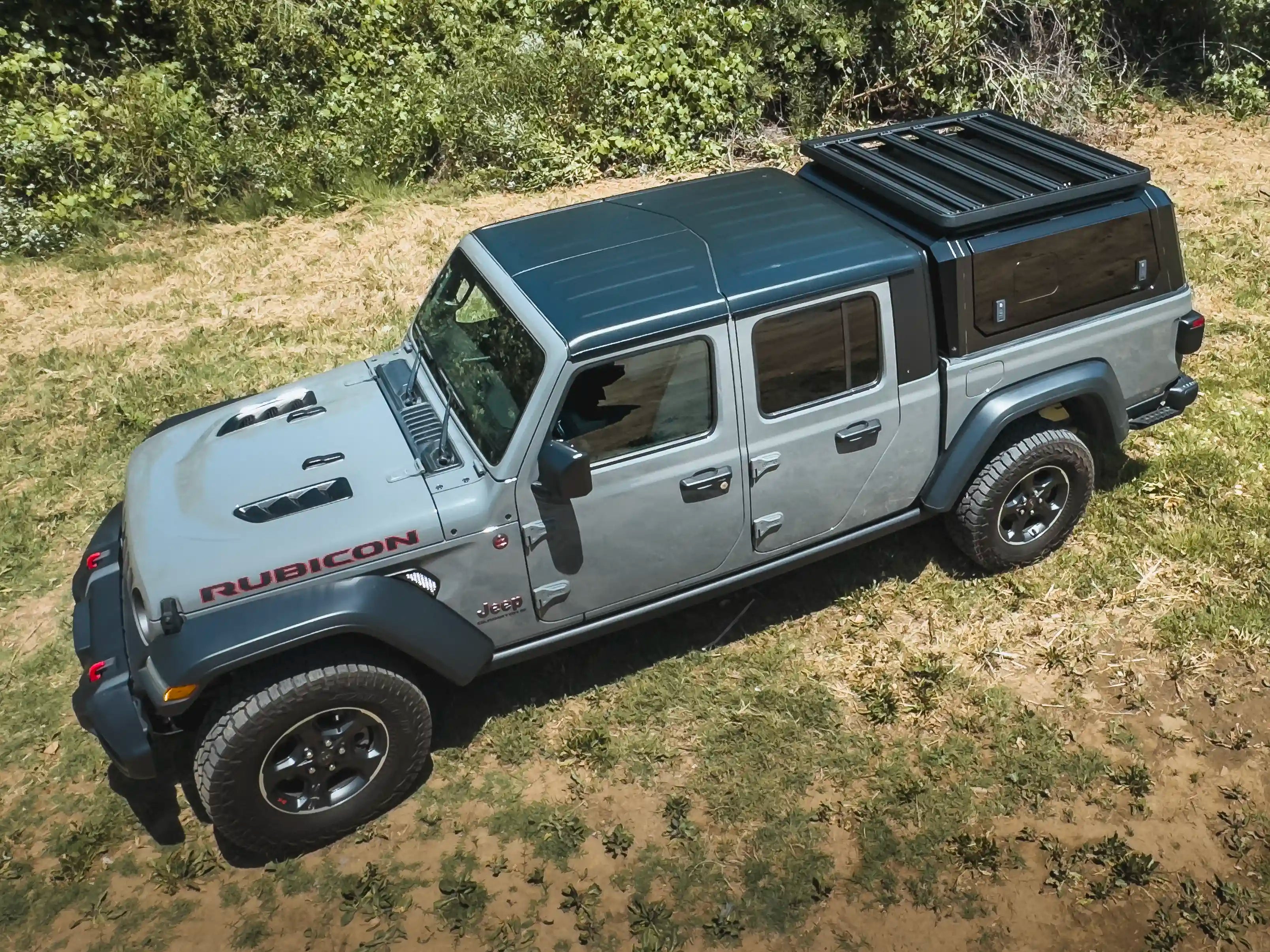 Truck with ACS Roof Platform on SmartCap navigating rugged terrain, emphasizing durability and off-road readiness.
